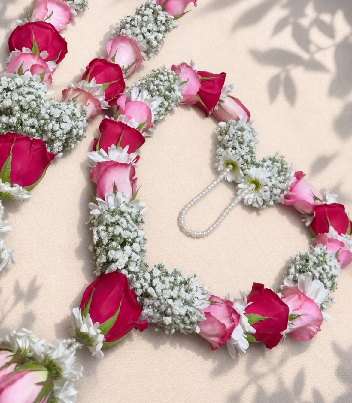 Blush and ruby rose garland with baby's breath and pearl loop