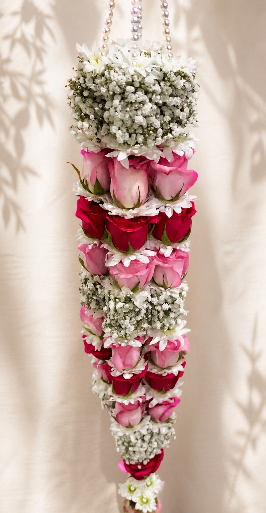 Layered pink and ruby rose hanging mala with baby's breath