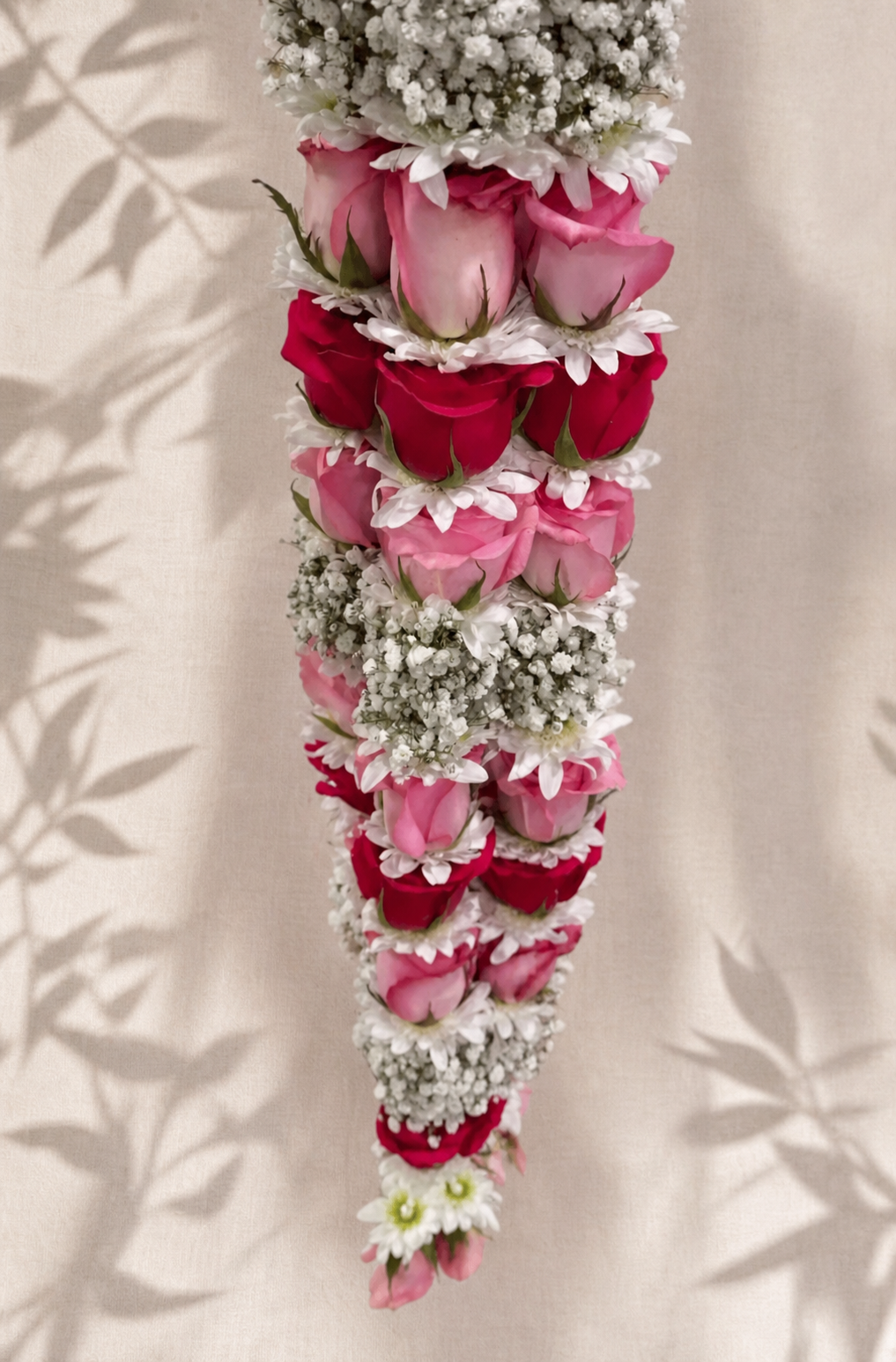 Natural pink and ruby rose celebration garland with white flowers