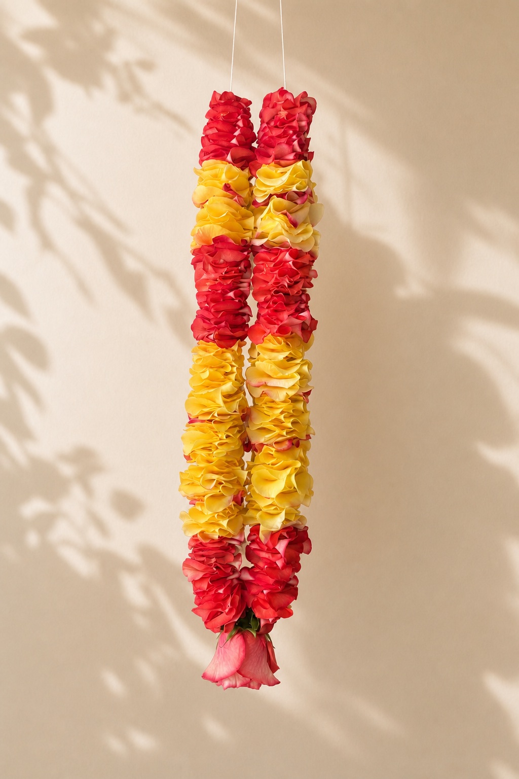Red and yellow rose petal garland product view