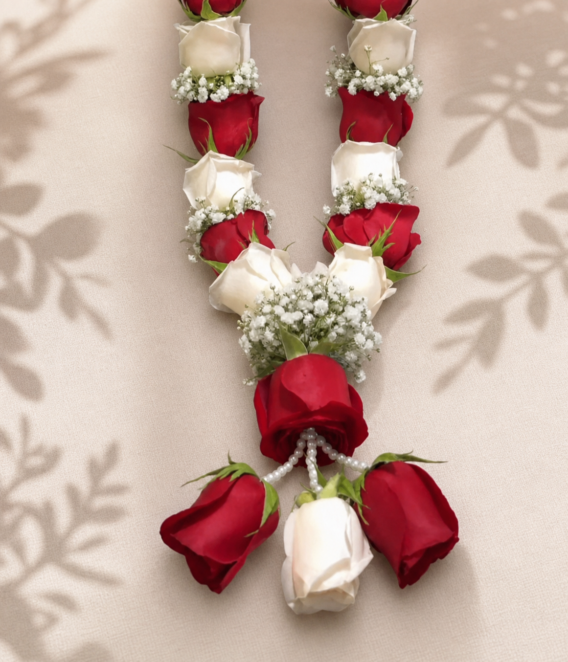 Handcrafted ruby red and ivory rose mala with baby's breath