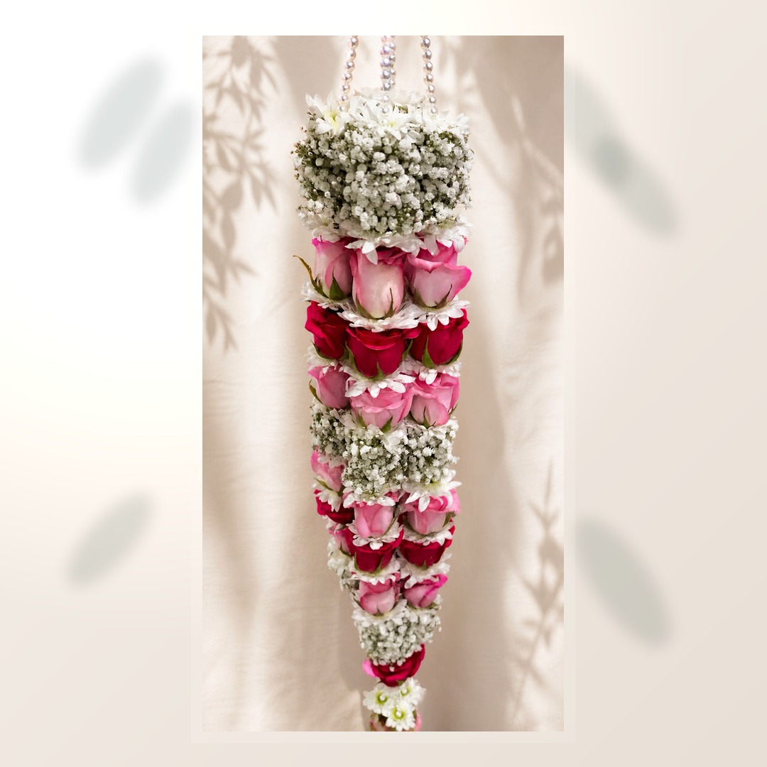 Layered pink and ruby rose hanging mala with baby's breath