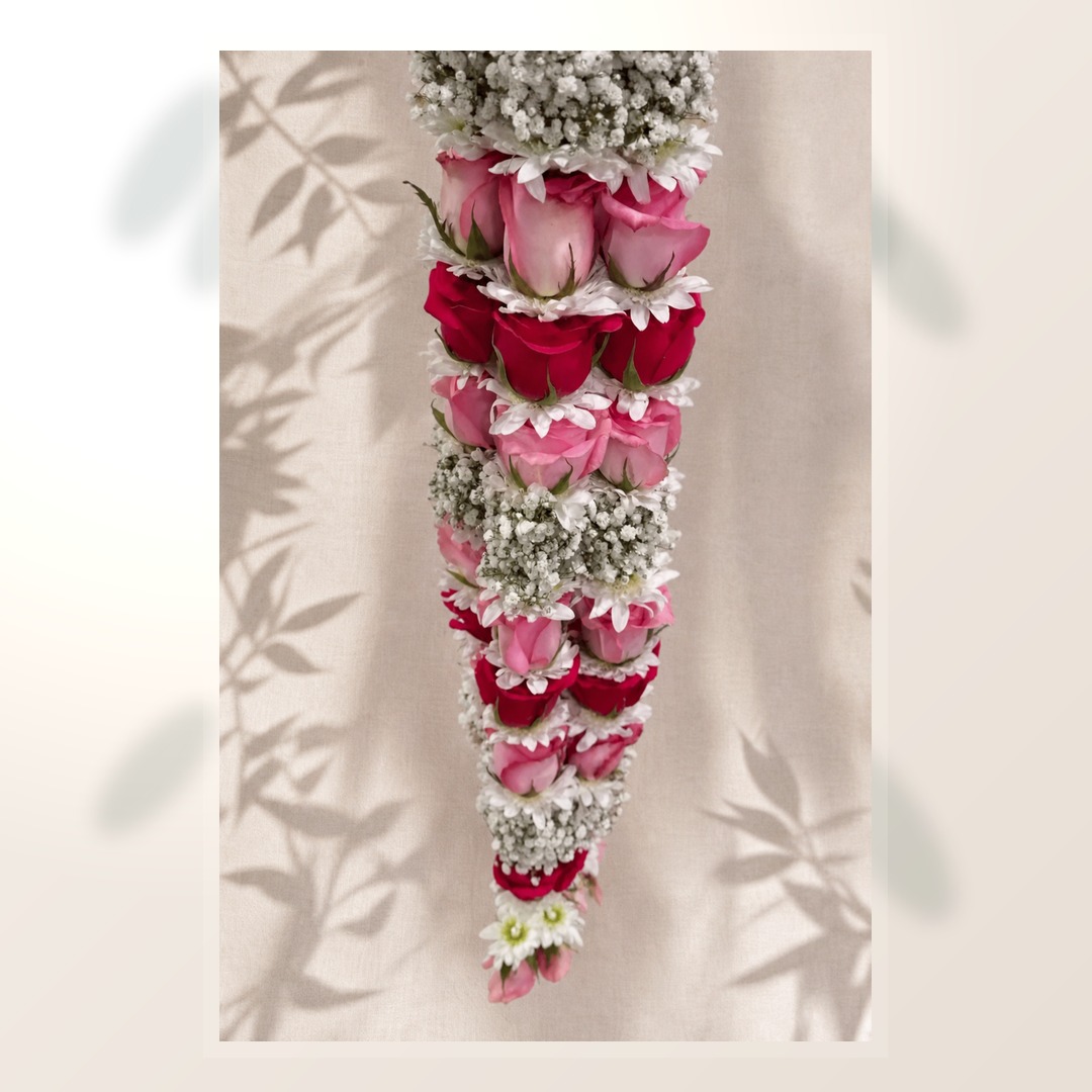 Natural pink and ruby rose celebration garland with white flowers
