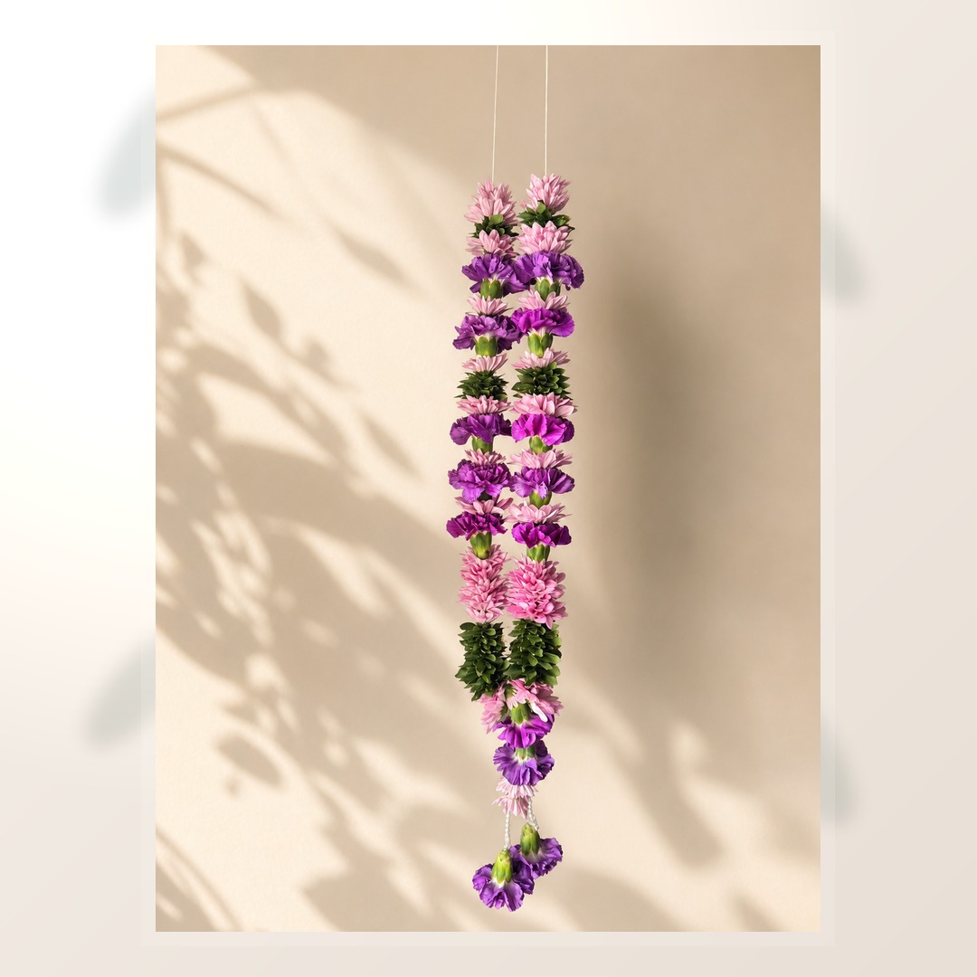 Purple and pink welcome garland alternate product view on ivory leaf-shadow backdrop