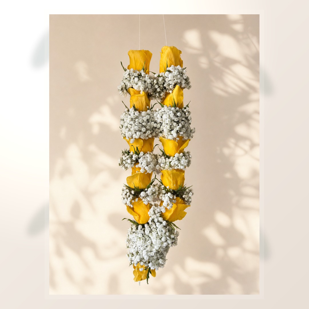 Golden yellow rose and baby's breath garland alternate product view on clean ivory backdrop
