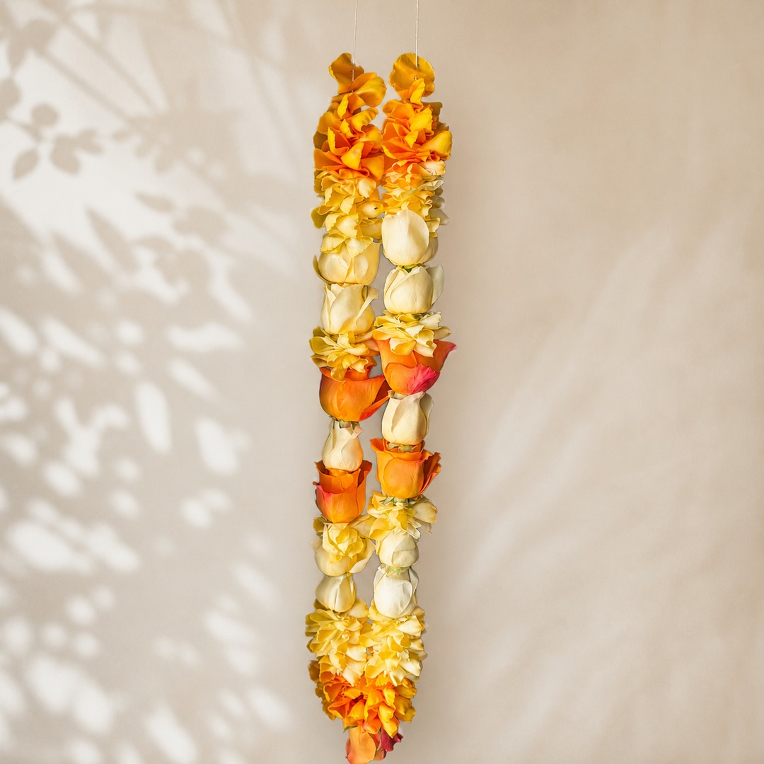 Alternate view of sunshine orange, yellow, and cream rose petal garland