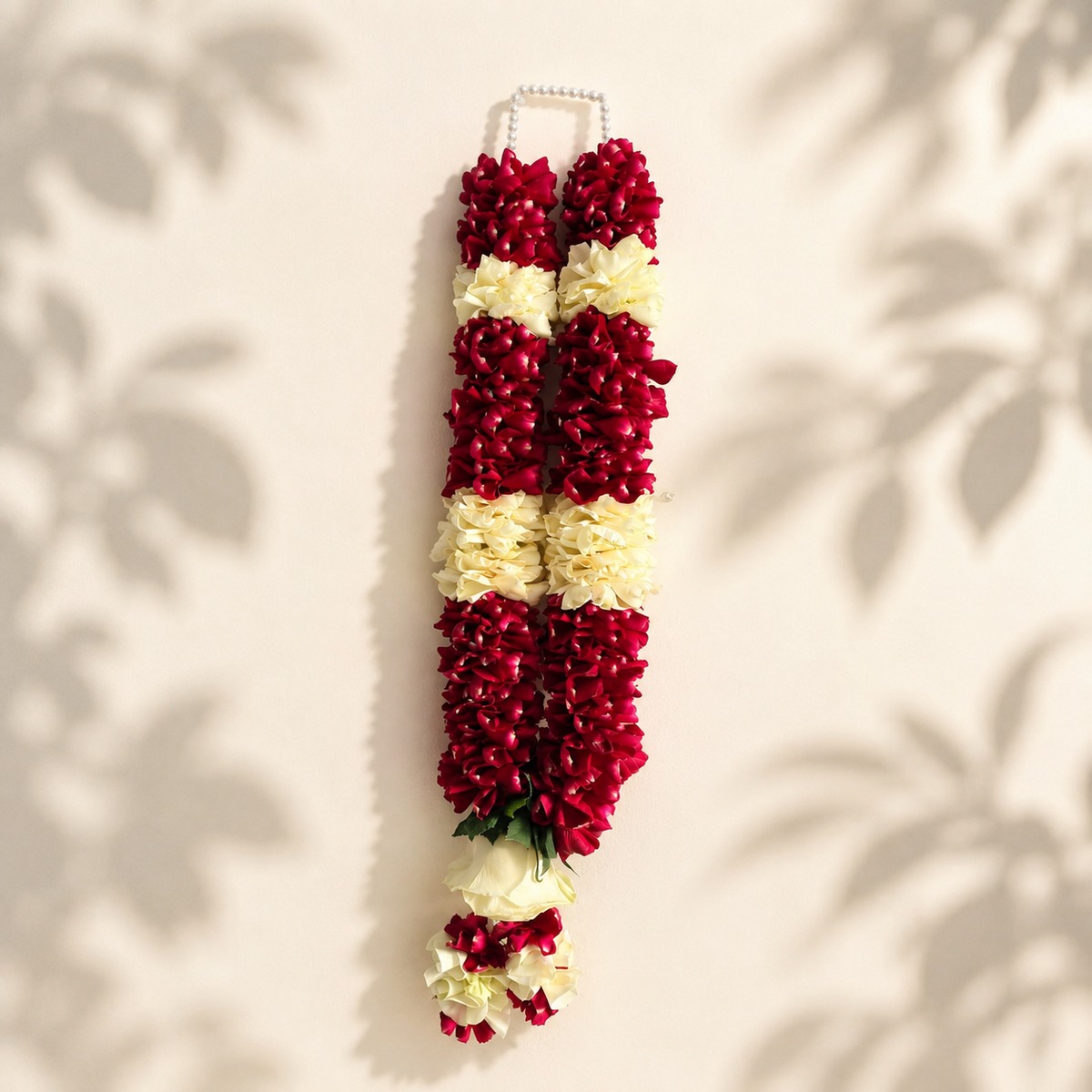 Alternate view of burgundy and ivory rose garland with pearl loop